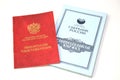 Pension card and savings book of Sberbank of Russia on a white background. Russian text - pension