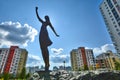 Russia . Ekaterinburg . Sculpture girl on the background of the urban landscape