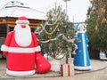 Russia, Engels - dec,2020: Symbols of the New Year, Santa Claus and Snow Maiden are standing near the New Year tree