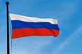 Russia Flag waving over blue sky Royalty Free Stock Photo