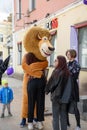 Animator in the costume of Alex the lion from the cartoon Madagascar in the city