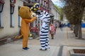 Animators in a lion and zebra costume from the cartoon Madagascar in the city