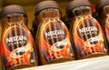 Glass packings of the Nescafe Classic instant coffee by Nestle corp. , shallow dof