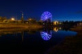 Russia, Irkutsk - June 13, 2020: Colorfull abstract Ferris wheel with reflection on the Konny island in Irkutsk city