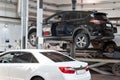 Russia, Izhevsk - April 21, 2018: Automobile workshop. Car repair in the workshop on the hydraulic lift. Royalty Free Stock Photo