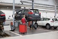 Russia, Izhevsk - April 21, 2018: Service center Toyota. Replacement and wheel alignment on a hydraulic lift Royalty Free Stock Photo
