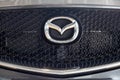 Russia, Izhevsk - August 06, 2020: Logo of Mazda car on display in the dealer showroom