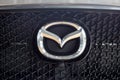 Russia, Izhevsk - August 06, 2020: Logo of Mazda car on display in the dealer showroom