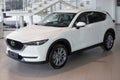Russia, Izhevsk - August 06, 2020: New modern crossover CX-5 in the Mazda showroom. Front and side view