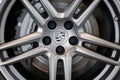 Russia, Izhevsk - August 04, 2020: Porsche showroom. The alloy wheel of a new Panamera 4 car. Cropped image