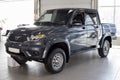 Russia, Izhevsk - August 20, 2021: UAZ showroom. New modern pick up UAZ Patriot in dealer showroom. Sollers automotive