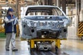 Russia, Izhevsk - December 15, 2018: LADA Automobile Plant Izhevsk. The female worker checks the body of a new car