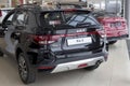 Russia, Izhevsk - February 17, 2022: KIA showroom. New modern Rio X and Cerato cars in dealer showroom. Back and side
