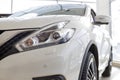 Russia, Izhevsk - February 19, 2021: Nissan showroom. New white Qashqai car in dealer showroom. Cropped image. Famous