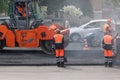 Russia, Izhevsk - May 30, 2018: Road work. Laying new asphalt on top of the old