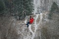 Russia, Izhevsk - November 18, 2018: Zipline. Man Sliding on rope trolley over ravine on high altitude. Extreme and