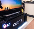 8k OLED TV LG home theater system, shows the demo pictures in an electronic shop