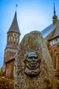 Russia, Kaliningrad, 05.11.2018: The gravestone on the grave of Immanuel Kant on the background of the Cathedral in Kenigsberg Royalty Free Stock Photo