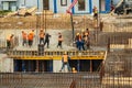 RUSSIA, KALUGA - AUGUST 15, 2022 : Concrete automatic pump tube working on construction site. Workers directing and Royalty Free Stock Photo