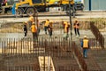 RUSSIA, KALUGA - AUGUST 15, 2022 : Concrete automatic pump tube working on construction site. Workers directing and Royalty Free Stock Photo