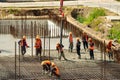 RUSSIA, KALUGA - AUGUST 15, 2022 : Concrete automatic pump tube working on construction site. Workers directing and Royalty Free Stock Photo