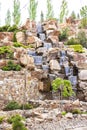 2021-05-07. Russia. Kamensk-Shakhtinsky, Rostov region. Beautiful decor elements in the park for tourists. Waterfall among the