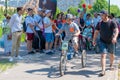 Russia, Kazan - May 31, 2019: A boy with Down Syndrome on a bicycle participates in a cycling race with his father on a sunny