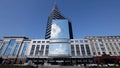Russia - Kazan, 1 October 2018: Time lapse of people walking in front of modern business centre in Kazan, blue sky