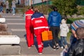 Russia Kemerovo 2019-05-21 Ambulance team of a woman in a red uniform with an orange medicine case is walking down the