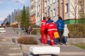 Russia Kemerovo 2019-05-21 Ambulance team of a woman in a red uniform with an orange medicine case is walking down the