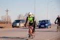 Russia Kemerovo 2019-04-11 Cycling competition, cyclist athletes in helmet and uniform tinkoff team riding race at high speed on Royalty Free Stock Photo