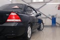 Russia Kemerovo 2019-01-05 Dark blue Nissan Almera car on professional car wash. Concept comprehensive care exterior, interior,