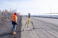 Russia Kemerovo 2019-03-15. Land and construction surveyor equipment. Geodesist controls robotic total station theodolite.