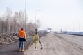Russia Kemerovo 2019-03-15. Land and construction surveyor equipment. Geodesist controls robotic total station theodolite.