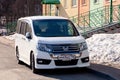 Russia Kemerovo 2019-04-11 white shining clean japan 4wd minibus car Honda Stepwgn Spada standing on background of the colorful
