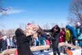 Celebrating the end of winter, children compete in a fight game with a pillow