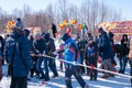 Celebrating the end of winter, people playing tug of war