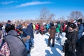 Celebrating the end of winter, people playing tug of war