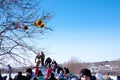 Shrovetide, people on a hill with a scarecrow