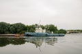 08/21/2021 Russia, Kolomna. An old rusty barge sails by on the Moscow River in summer