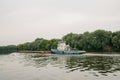 08/21/2021 Russia, Kolomna. An old rusty barge sails by on the Moscow River in summer
