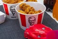 Russia Kostroma 04 24 2021 KFC chicken basket in a paper cup on the table