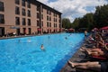 Russia Kostroma 08 14 2022 swimming pool with vacationers near a modern hotel