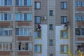 09 21 2021 Russia Kostroma Workers insulate the walls of an apartment building with foam