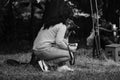 4.09.21 Russia Krasnodar dog show of the German Shepherd breed. Black and white monochrome photo. Woman sits and hugs her dog