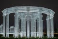 Russia,Krasnodar 07.01.2022. Luminous huge colonnade in Roman style decorates the park at night.