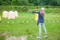 Russia Krasnodar Territory May 12,2018 Young blond girl shoots with an arrow