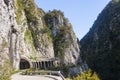 A rocky section of the Old Krasnopolyansky highway. Mountain river Mzymta.