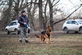 Russia, Krasnodar 31.01.2021 training of working dogs at the stadium. Training to protect German Shepherd. Dog on leash and