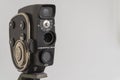 Russia, Krasnoyarsk, December 2019: Soviet cinema camera quartz 2M on a tripod, white background